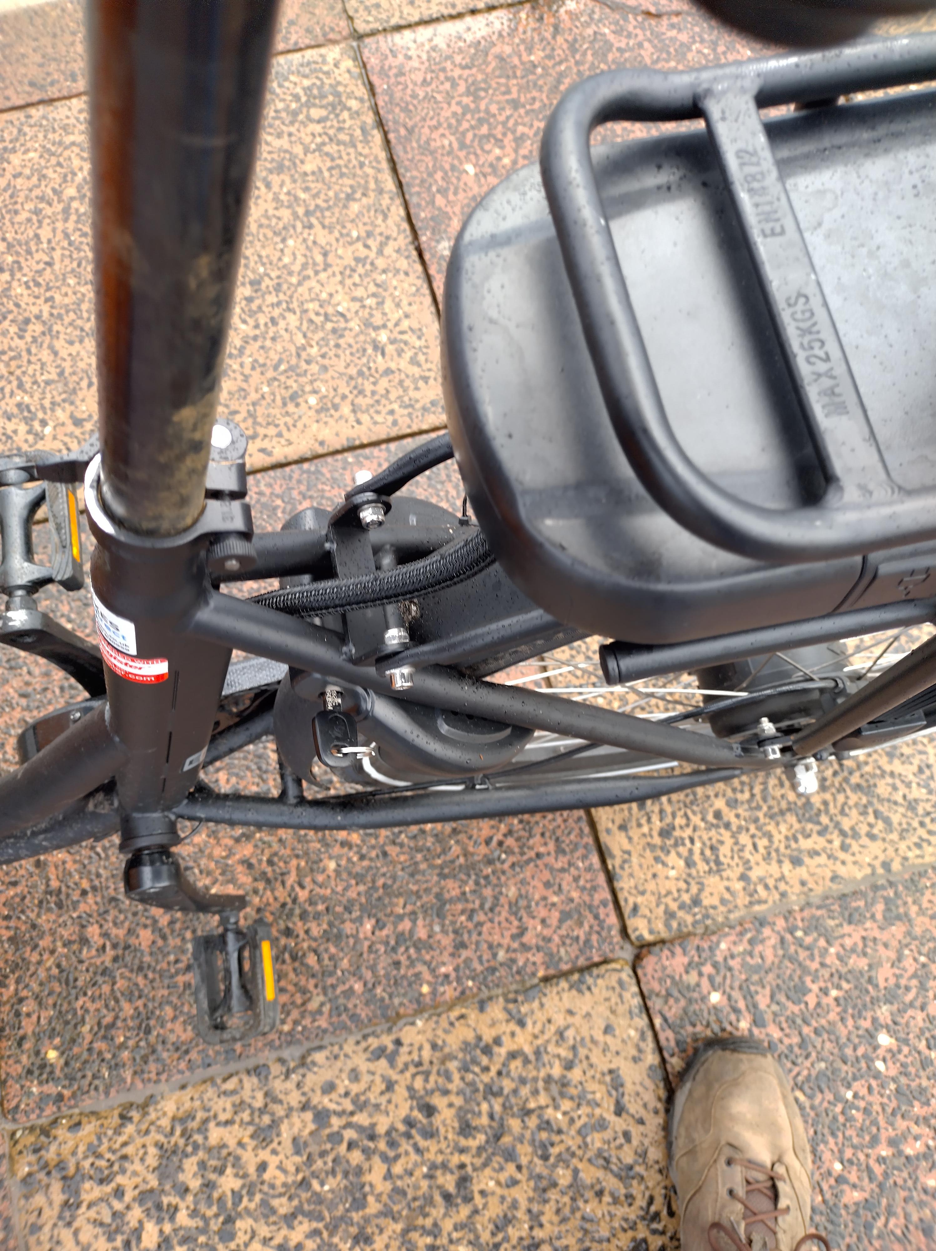 Looking down the seat post at the back wheel. The frame lock is attached to the fork and wraps around the wheel.